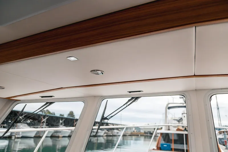 Slide: The Image of Interior view of 2024 Lindell 46 yacht, showcasing elegant wood trim and modern design. - 61