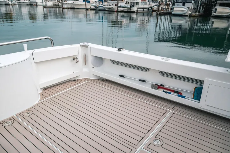 Slide: The Image of Spacious deck of 2024 Lindell 46 yacht, featuring sleek design and marina view. - 65