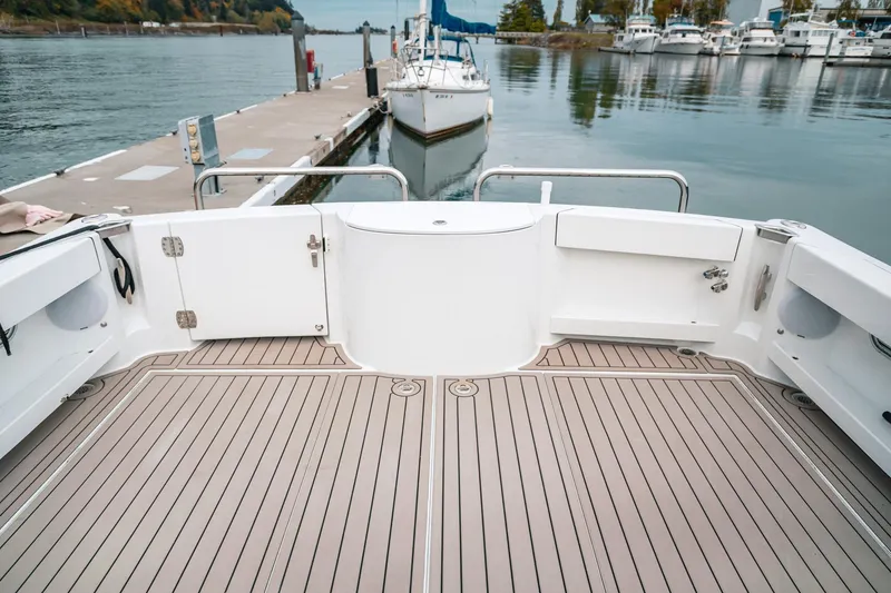 Slide: The Image of Spacious deck of 2024 Lindell 46 yacht docked at marina. - 66