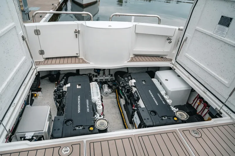 Slide: The Image of Engine compartment of 2024 Lindell 46 boat with Volvo Penta engines at dock. - 76