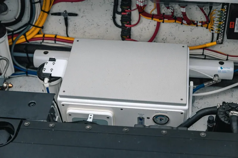 Slide: The Image of Engine compartment of 2024 Lindell 46 with wiring and mechanical components. - 79