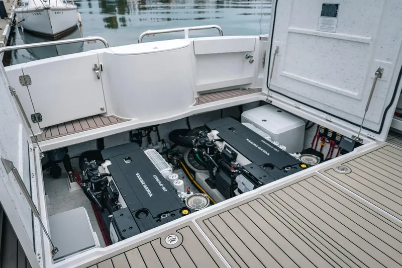 Slide: The Image of 2024 Lindell 46 boat engine compartment with Volvo Penta engines, docked at marina. - 8