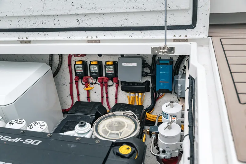 Slide: The Image of Engine compartment of 2024 Lindell 46 boat, showcasing electrical components and wiring. - 81