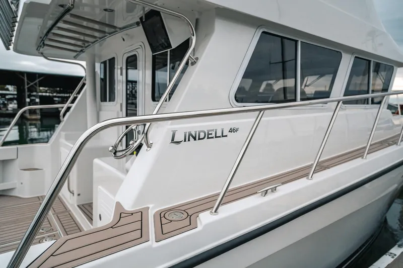 Slide: The Image of 2024 Lindell 46 yacht, sleek design with modern features, docked at marina. - 83