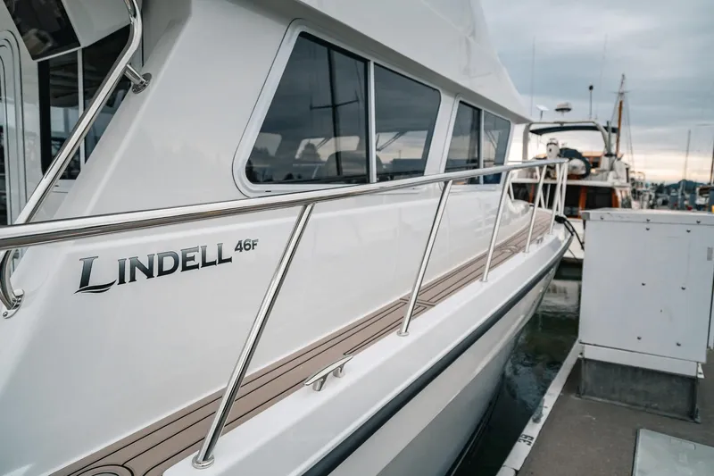 Slide: The Image of 2024 Lindell 46 yacht docked at marina, showcasing sleek design and modern features. - 84