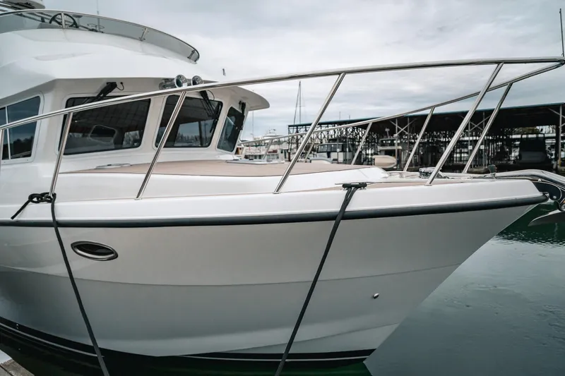 Slide: The Image of 2024 Lindell 46 yacht docked at marina, showcasing sleek design and modern features. - 87
