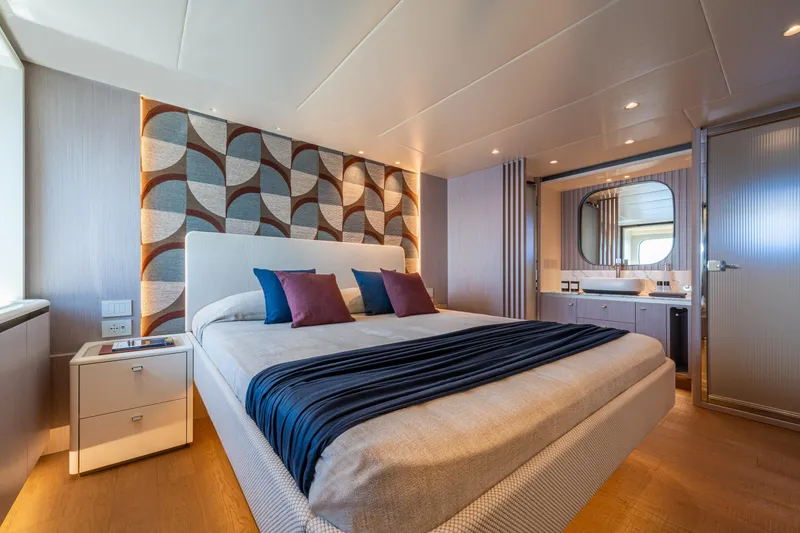 Slide: The Image of Luxurious bedroom on 2026 Absolute 62' Navetta yacht with modern decor and ensuite bathroom. - 24