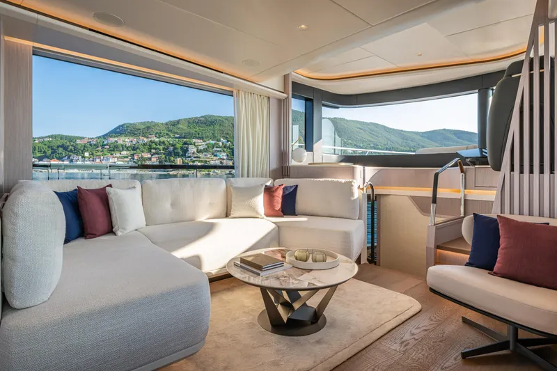 Slide: The Image of Luxurious interior of 2026 Absolute 62' Navetta yacht with scenic ocean view. - 16