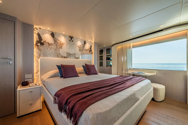 Slide: The Image of Luxurious bedroom on 2026 Absolute 62' Navetta yacht with ocean view and elegant decor. - 21