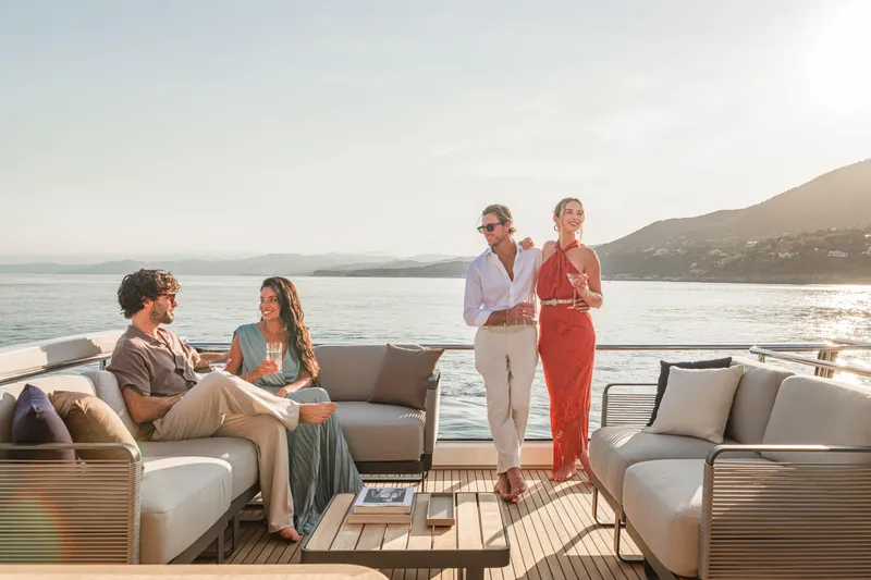 Slide: The Image of People enjoying a luxurious cruise on a 2026 Absolute 62' Navetta yacht. - 9