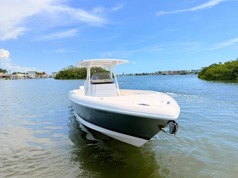 Slide: The Image of Intrepid 327CC boat 2020 on calm water under clear sky. - 21