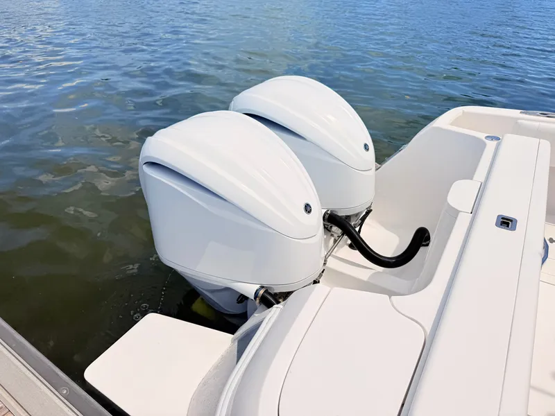 Slide: The Image of Intrepid 327CC 2020 with twin outboard engines on calm water. - 26