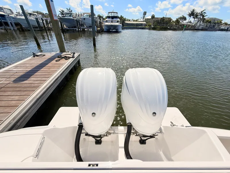 Slide: The Image of Intrepid 327CC 2020 with twin outboard engines at dock. - 28