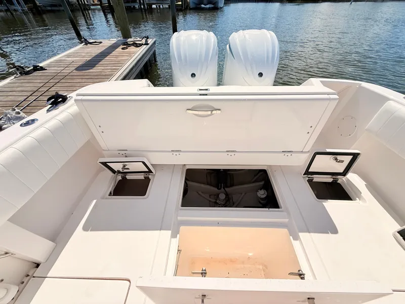 Slide: The Image of Intrepid 327CC 2020 boat with open storage at dock. - 31