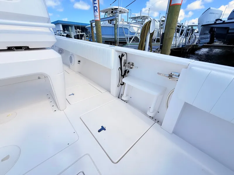 Slide: The Image of Intrepid 327CC 2020 boat dock with storage and seating area. - 34