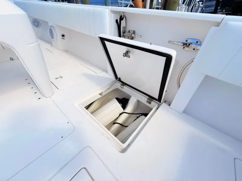 Slide: The Image of Intrepid 327CC 2020 boat with open storage hatch. - 35
