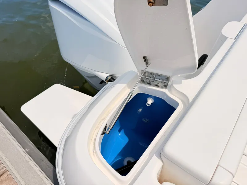 Slide: The Image of Intrepid 327CC 2020 with open storage compartment at the stern. - 37