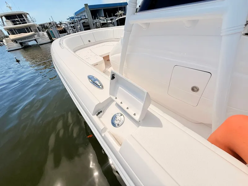 Slide: The Image of Intrepid 327CC 2020 boat docked with luxurious design. - 41