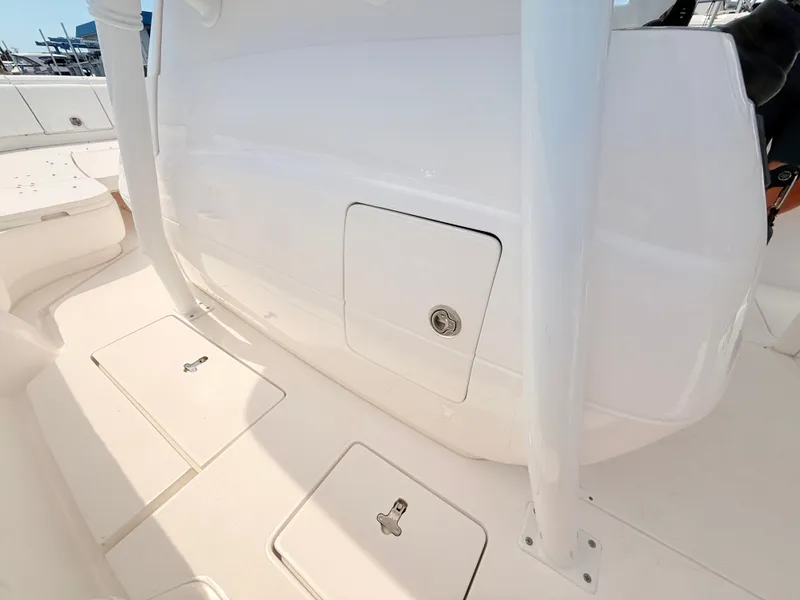 Slide: The Image of Intrepid 327CC 2020 boat deck with storage compartment. - 42