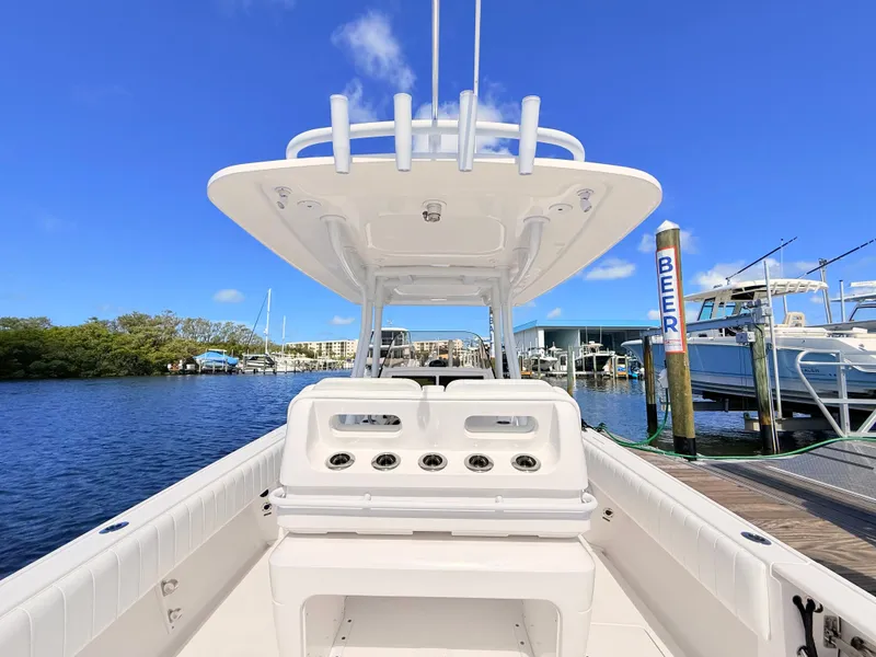 Slide: The Image of Intrepid 327CC 2020 boat docked under clear blue sky. - 44