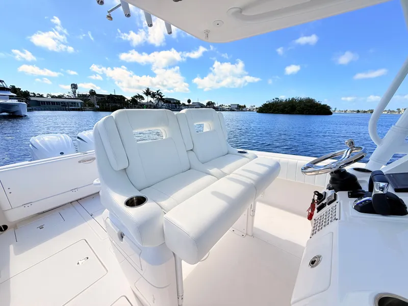 Slide: The Image of Intrepid 327CC 2020 boat with white cockpit and water view. - 46