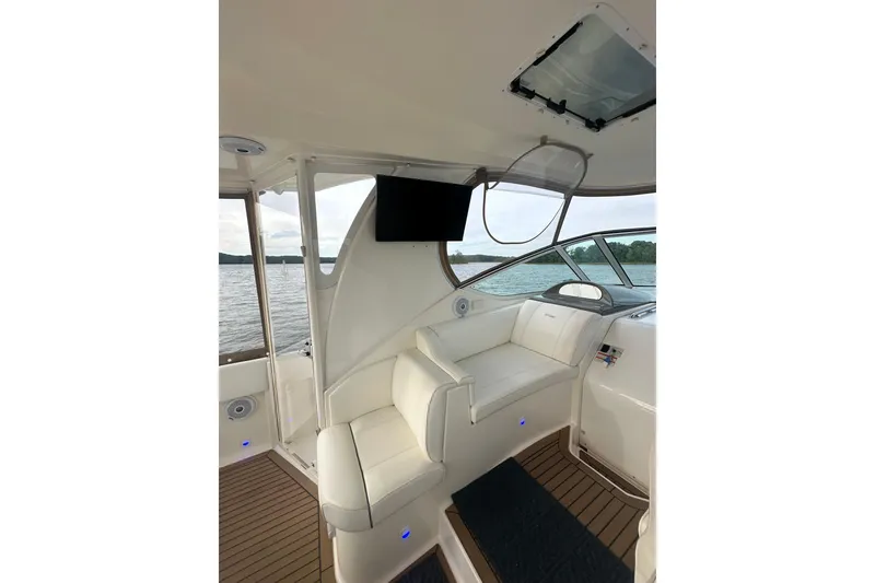 Slide: The Image of 2008 Cruisers Yachts 415 Express Motoryacht interior with seating and water view. - 17