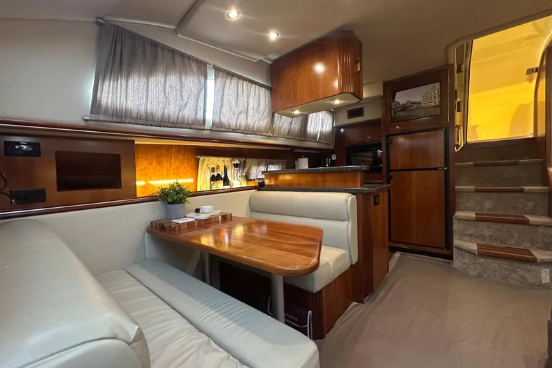 Slide: The Image of Luxurious interior of 2008 Cruisers Yachts 415 Express Motoryacht with dining area and kitchen. - 23