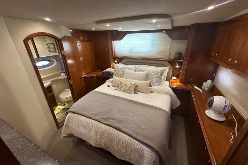Slide: The Image of Luxurious bedroom in 2008 Cruisers Yachts 415 Express Motoryacht with elegant wood cabinetry. - 26