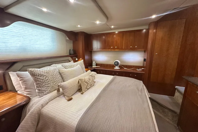 Slide: The Image of Luxurious bedroom interior of 2008 Cruisers Yachts 415 Express Motoryacht with elegant wood cabinetry. - 27