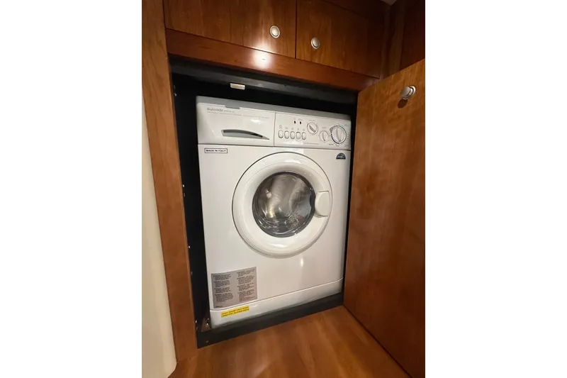 Slide: The Image of Washing machine inside 2008 Cruisers Yachts 415 Express Motoryacht wooden cabinet. - 32