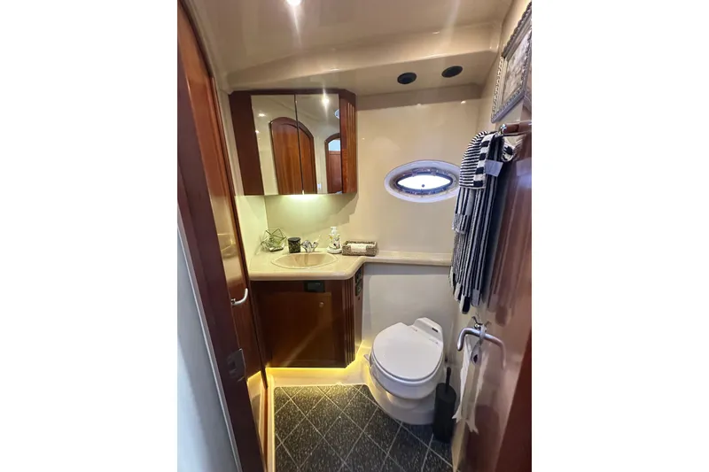 Slide: The Image of Luxurious bathroom in 2008 Cruisers Yachts 415 Express Motoryacht with elegant fixtures and porthole window. - 33