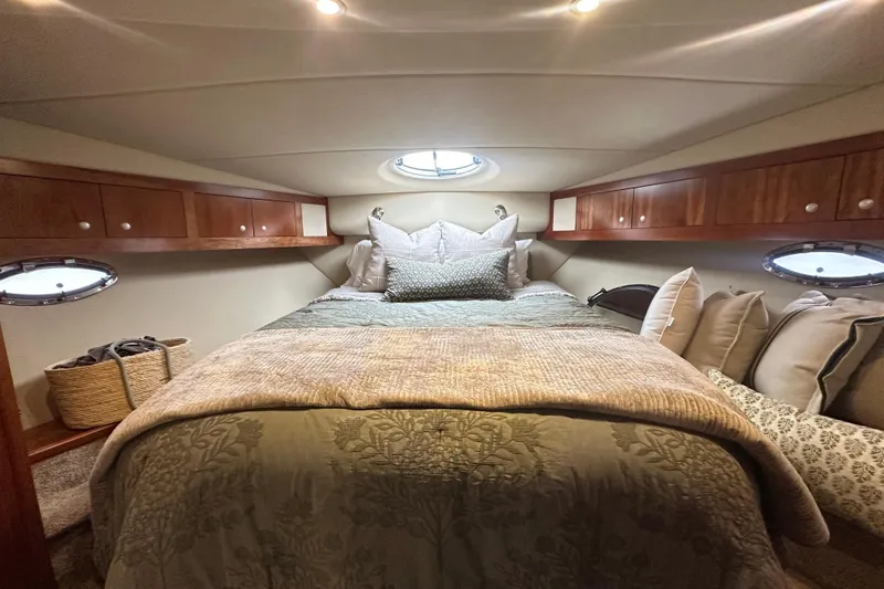 Slide: The Image of Luxurious cabin interior of 2008 Cruisers Yachts 415 Express Motoryacht with cozy bedding. - 34