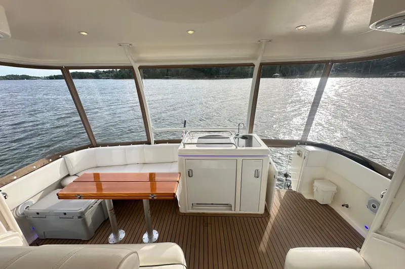Slide: The Image of Luxurious 2008 Cruisers Yachts 415 Express Motoryacht interior with scenic water view. - 8
