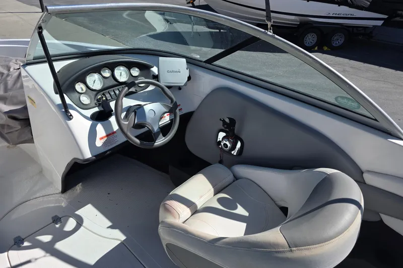 Slide: The Image of Interior of a 2014 Reinell 207 LS boat with steering wheel and dashboard. - 10