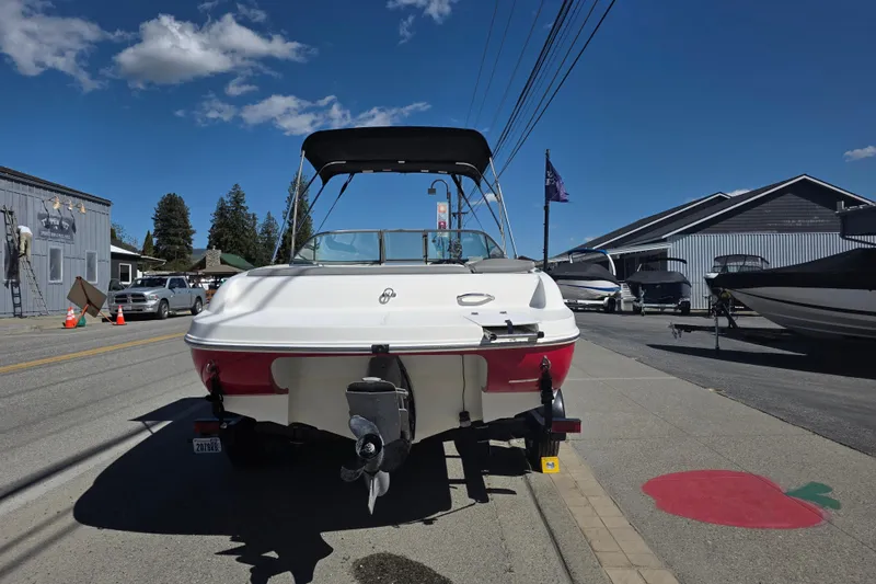 Slide: The Image of 2014 Reinell 207 LS boat parked on a sunny street with blue sky. - 3