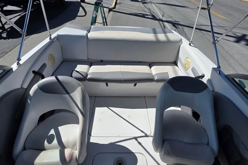 Slide: The Image of 2014 Reinell 207 LS boat interior with seating and open deck layout. - 8