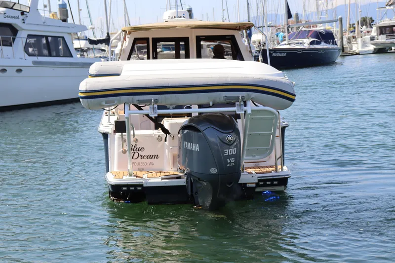 Slide: The Image of 2023 Ranger Tugs R-27 boat with Yamaha 300 V6 engine in a marina. - 4