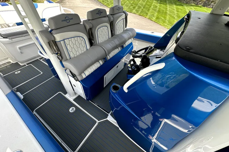 Slide: The Image of 2023 Fountain 43 NX boat interior with sleek seating and modern dashboard design. - 12