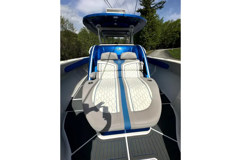 Slide: The Image of 2023 Fountain 43 NX boat with luxurious seating and sleek design. - 17