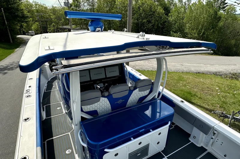 Slide: The Image of 2023 Fountain 43 NX boat with blue accents and advanced navigation systems. - 20