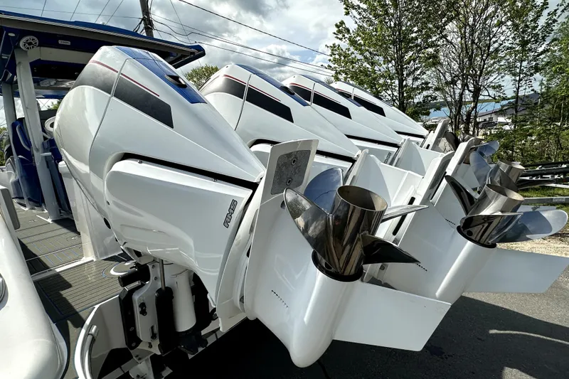 Slide: The Image of 2023 Fountain 43 NX boat engines with sleek design and powerful propellers. - 23