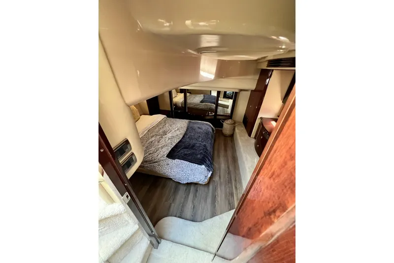 Slide: The Image of Luxurious bedroom interior of 2007 Sea Ray 58 Sedan Bridge yacht with elegant furnishings. - 101