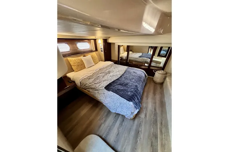 Slide: The Image of Luxurious bedroom interior of 2007 Sea Ray 58 Sedan Bridge yacht with cozy bedding. - 102