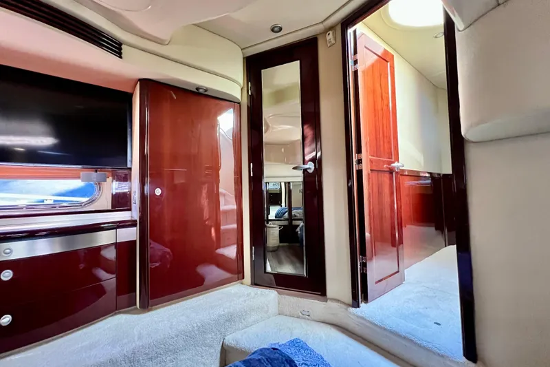Slide: The Image of Luxurious interior of a 2007 Sea Ray 58 Sedan Bridge yacht with polished wood finishes. - 109