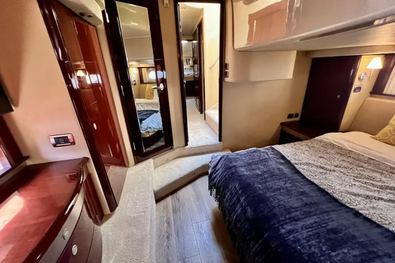 Slide: The Image of Luxurious interior of 2007 Sea Ray 58 Sedan Bridge yacht, featuring elegant wood finishes. - 111