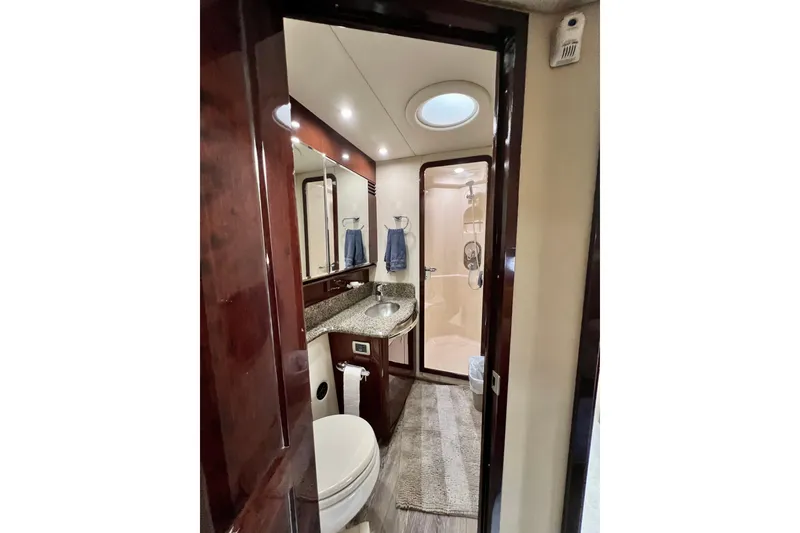 Slide: The Image of Luxurious bathroom interior of 2007 Sea Ray 58 Sedan Bridge yacht with granite countertop. - 112