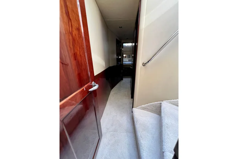 Slide: The Image of Interior hallway of 2007 Sea Ray 58 Sedan Bridge yacht with wooden finishes. - 114