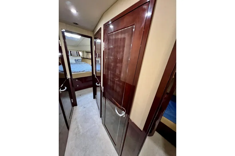 Slide: The Image of Luxurious interior of 2007 Sea Ray 58 Sedan Bridge yacht, featuring elegant wood finishes. - 119