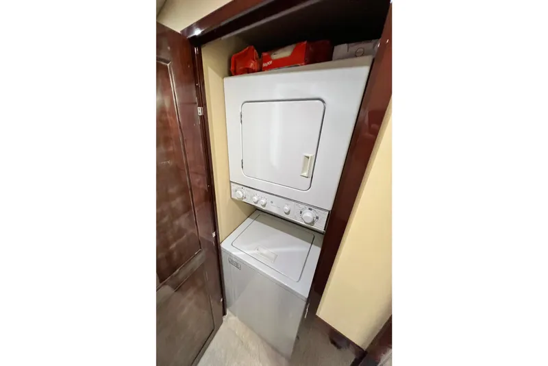 Slide: The Image of Stacked washer and dryer in 2007 Sea Ray 58 Sedan Bridge yacht. - 120