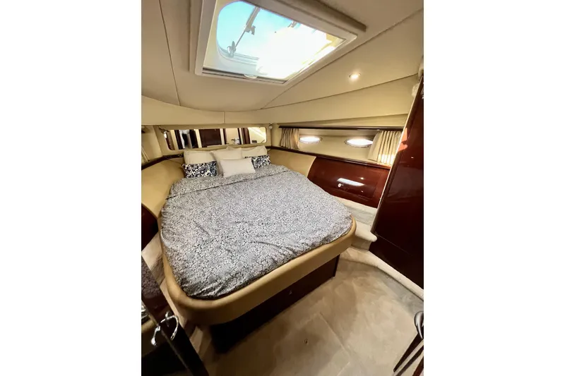 Slide: The Image of Luxurious bedroom interior of 2007 Sea Ray 58 Sedan Bridge yacht with skylight. - 123